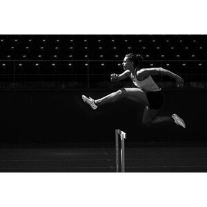Umělecká fotografie A runner taking on the hurdles., Sawaya Photography, (40 x 26.7 cm)