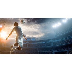 Umělecká fotografie Soccer player kicking ball in stadium, Dmytro Aksonov, (40 x 20 cm)