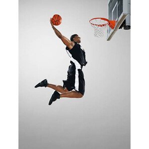 Umělecká fotografie Basketball player dunking ball, low angle view, Blake Little, (30 x 40 cm)