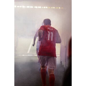 Umělecká fotografie A professional male soccer player jogs, Lighthouse Films, (26.7 x 40 cm)