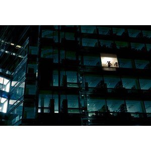 Umělecká fotografie Office building at night, man standing, Nick Dolding, (40 x 26.7 cm)