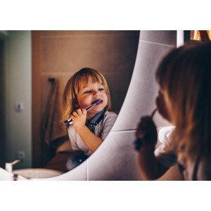 Umělecká fotografie sweet young boy is brushing teeth, StockPlanets, (40 x 30 cm)