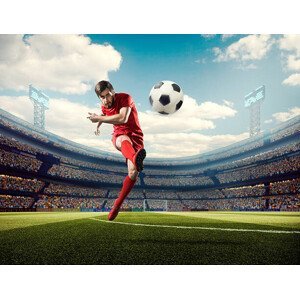 Umělecká fotografie Soccer player kicking ball in stadium, Dmytro Aksonov, (40 x 30 cm)