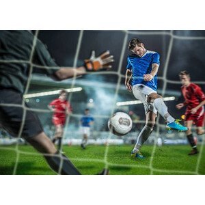 Umělecká fotografie Soccer player kicking ball at goal, Bernhard Lang, (40 x 30 cm)
