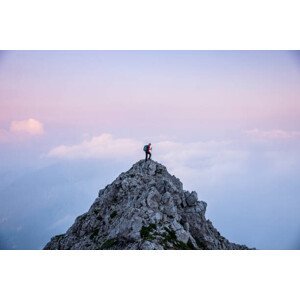 Umělecká fotografie Hiker man on the top of mountain during twilight, massimo colombo, (40 x 26.7 cm)