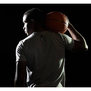 Umělecká fotografie man holding basketball on shoulder, Tara Moore, (40 x 35 cm)