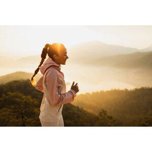 Umělecká fotografie Happy young woman running outdoors with, Oleg Breslavtsev, (40 x 26.7 cm)