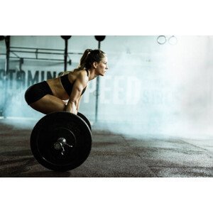 Umělecká fotografie Side view of athletic woman exercising, skynesher, (40 x 26.7 cm)