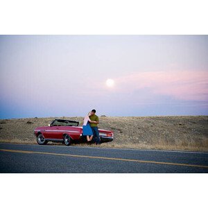 Umělecká fotografie man and woman next to a red convertible, Mike Kemp, (40 x 26.7 cm)