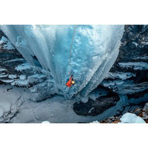Umělecká fotografie A woman ice climbs up a, Alex Ratson, (40 x 26.7 cm)
