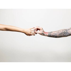 Umělecká fotografie Man with tattooed arm placing ring, ballyscanlon, (40 x 30 cm)
